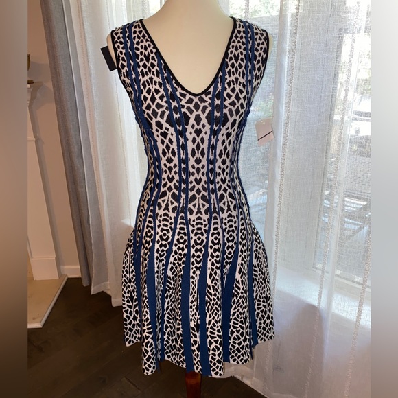 RVN Dresses & Skirts - RVN - new w/tags. medium stretch alligator flared dress